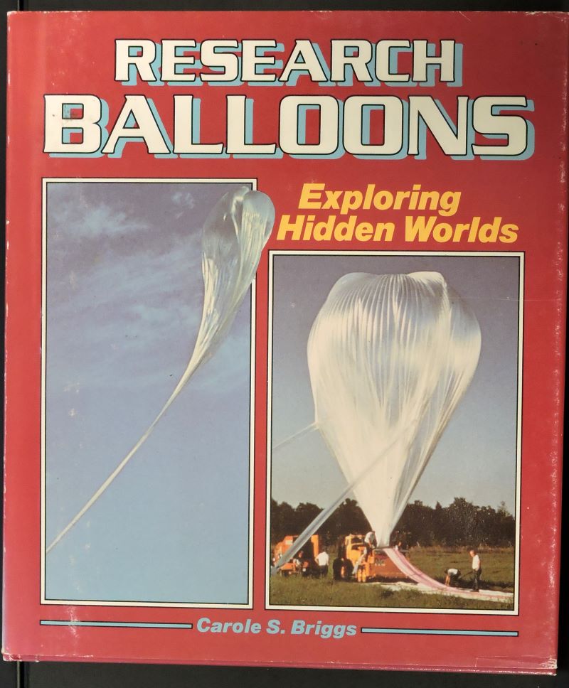 Picture of colour pictorial book jacket showing transparent high altitude balloon in two stages of inflation on the ground.